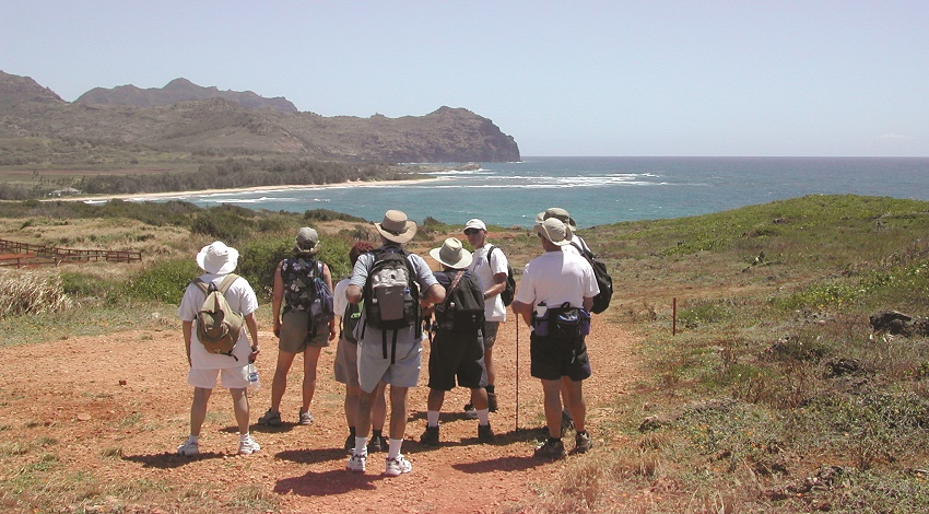 Road Scholars hiking within view of the ocean in Hawaii