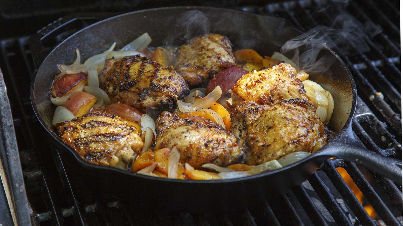 cast_iron_brown_sugar_bourbon_chicken_thighs_with_peaches_2000x1125.jpg