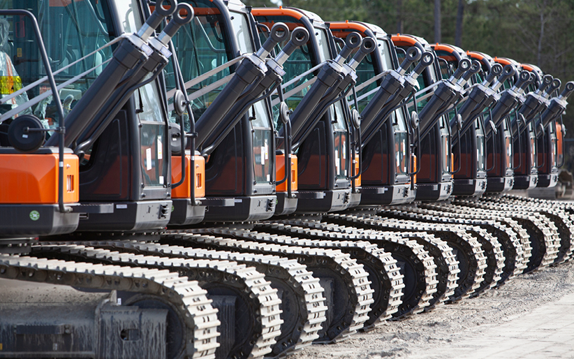 Photo of lineup of DEVELON excavators.