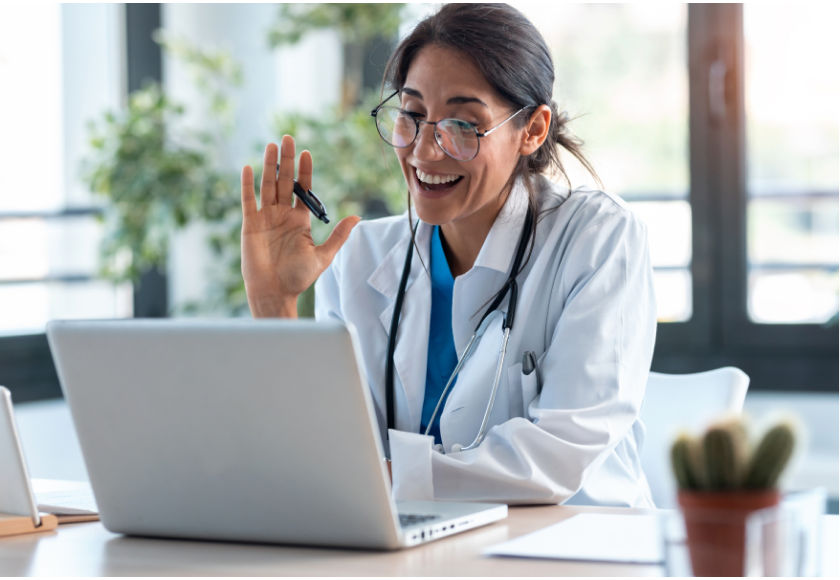 doctor waving on zoom laptop call