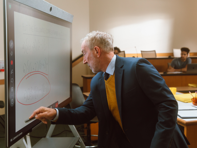 Man drawing on whiteboard Man drawing on whiteboard