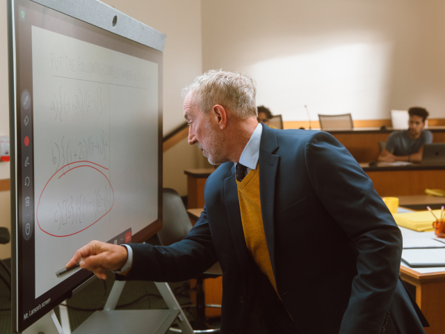 Man drawing on whiteboard