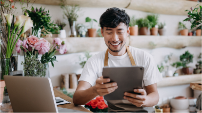 flower shop employee on tablet