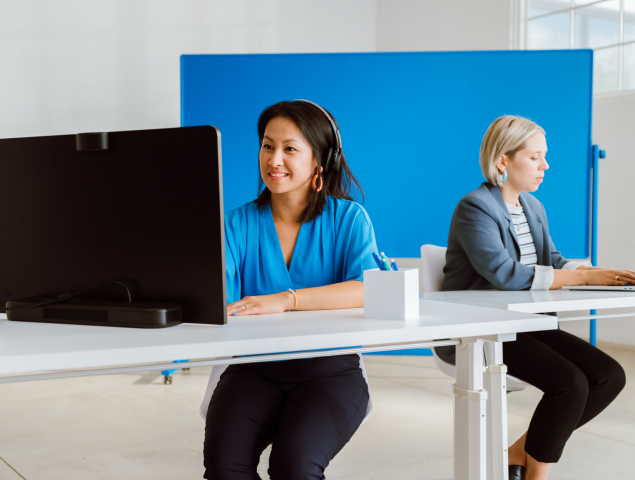 Two women working as desk