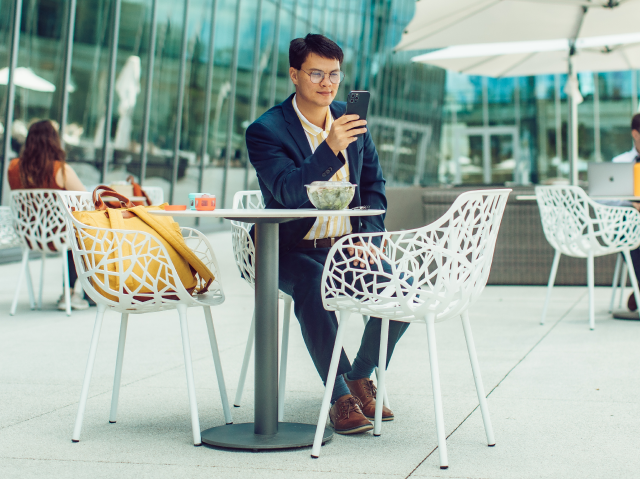 man sitting outside at table man sitting outside at table