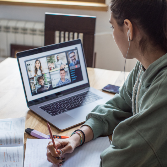 Woman taking notes on Zoom meetings